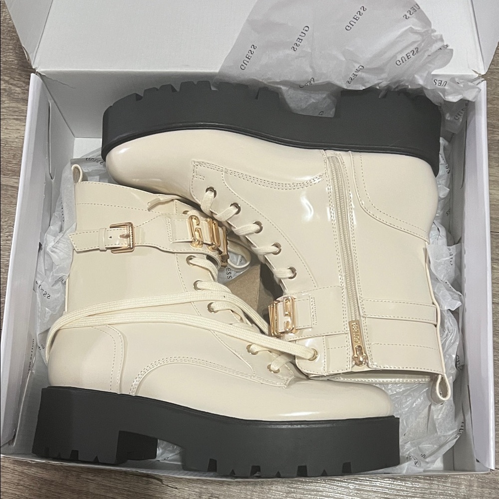 GUESS Women’s Vaires lug sole cuff lace up logo plated combat booties